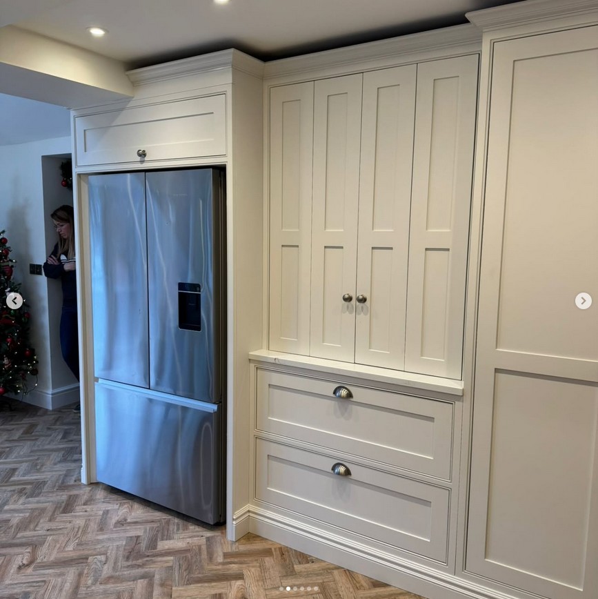 Bespoke kitchen with integrated fridge and custom cabinetry