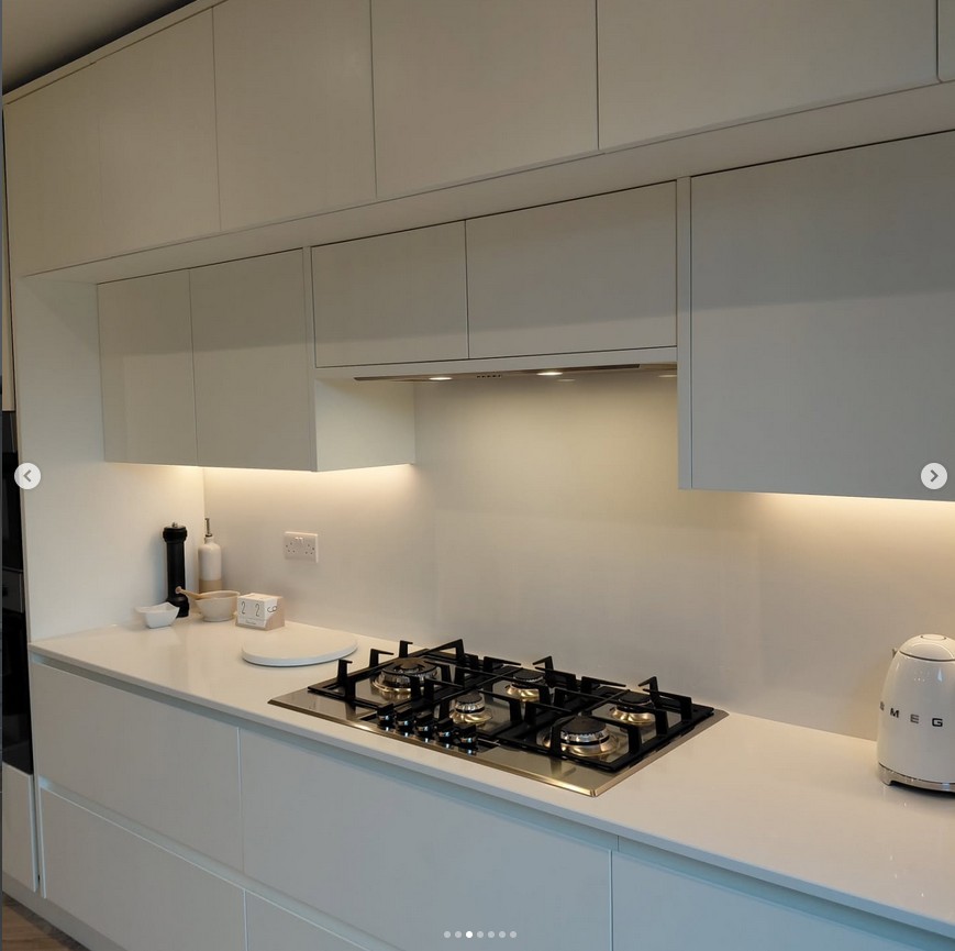 Minimalist kitchen with handleless cabinetry and integrated appliances