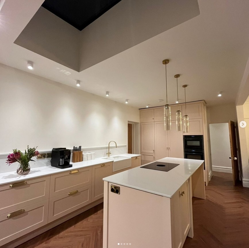 Elegant kitchen with skylight and bespoke cabinetry