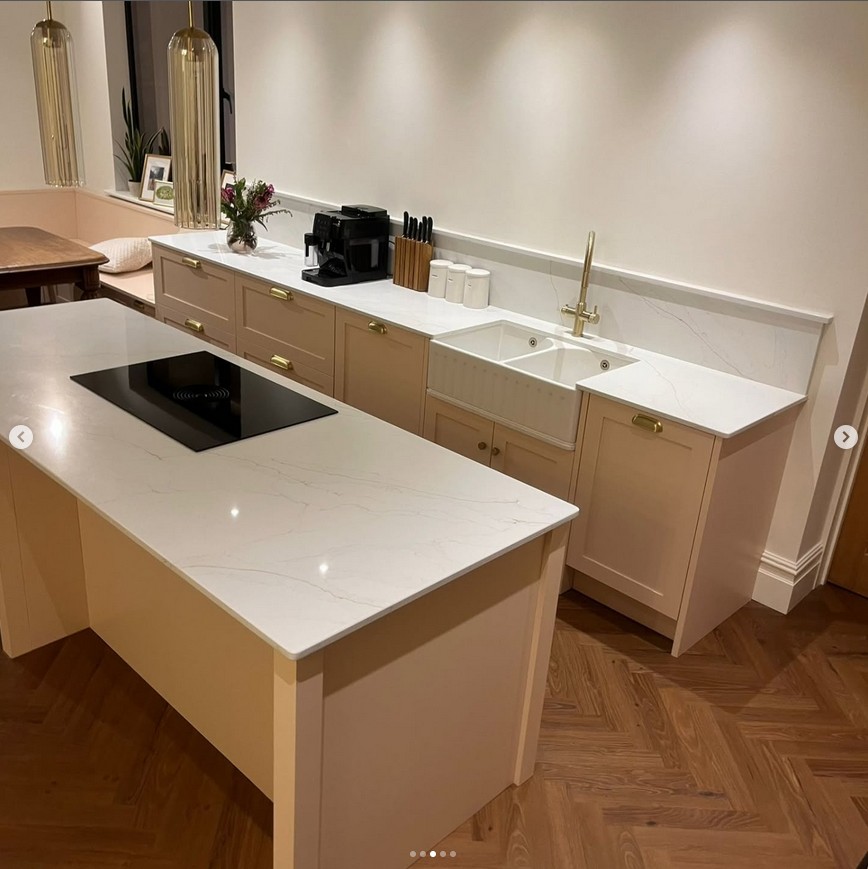 Luxury kitchen with brass fixtures and statement lighting