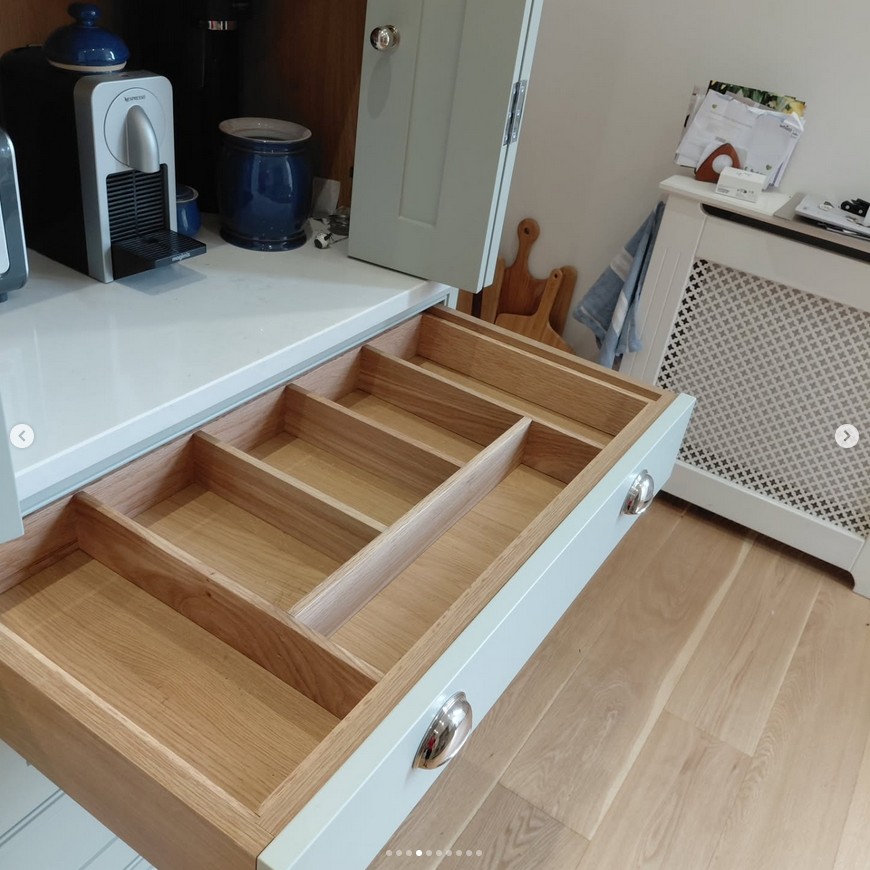 Kitchen with custom oak drawer inserts and organizational storage