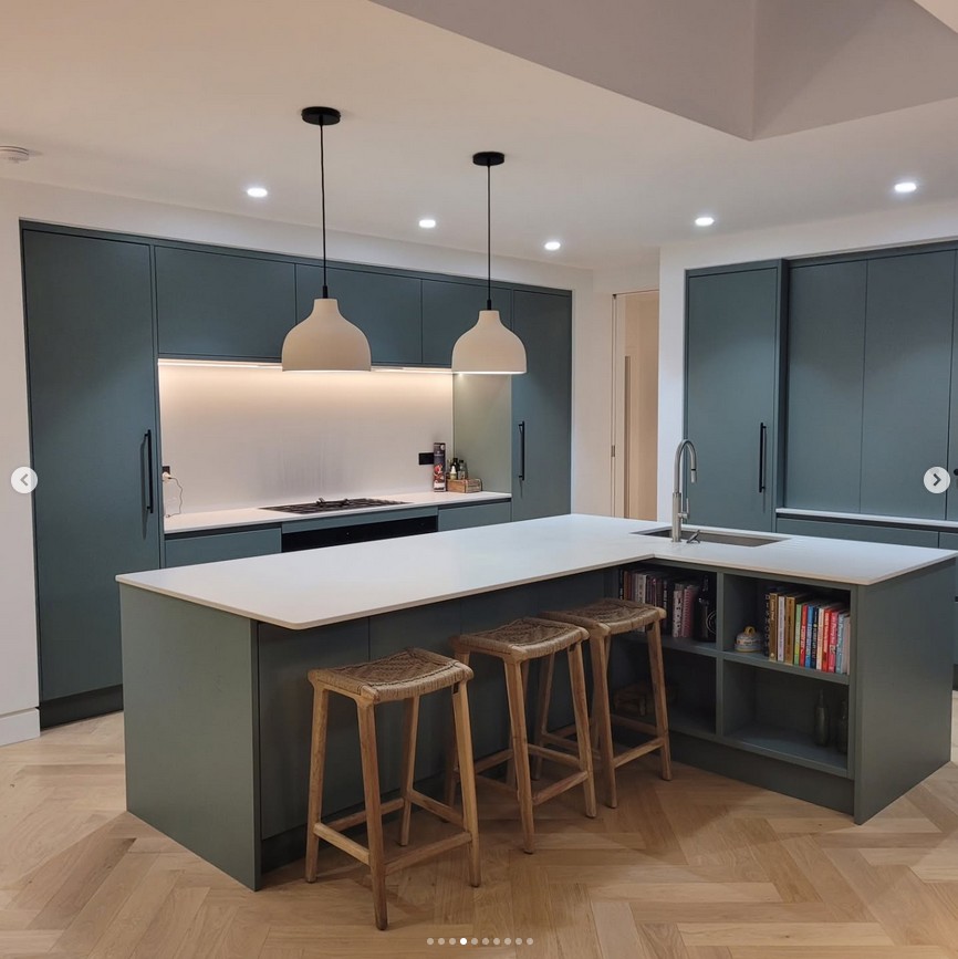Contemporary kitchen with dark cabinetry and breakfast bar