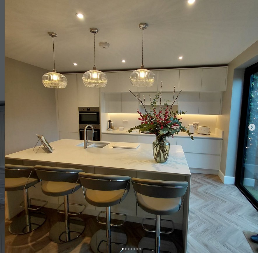 Luxury kitchen with statement lighting and marble island
