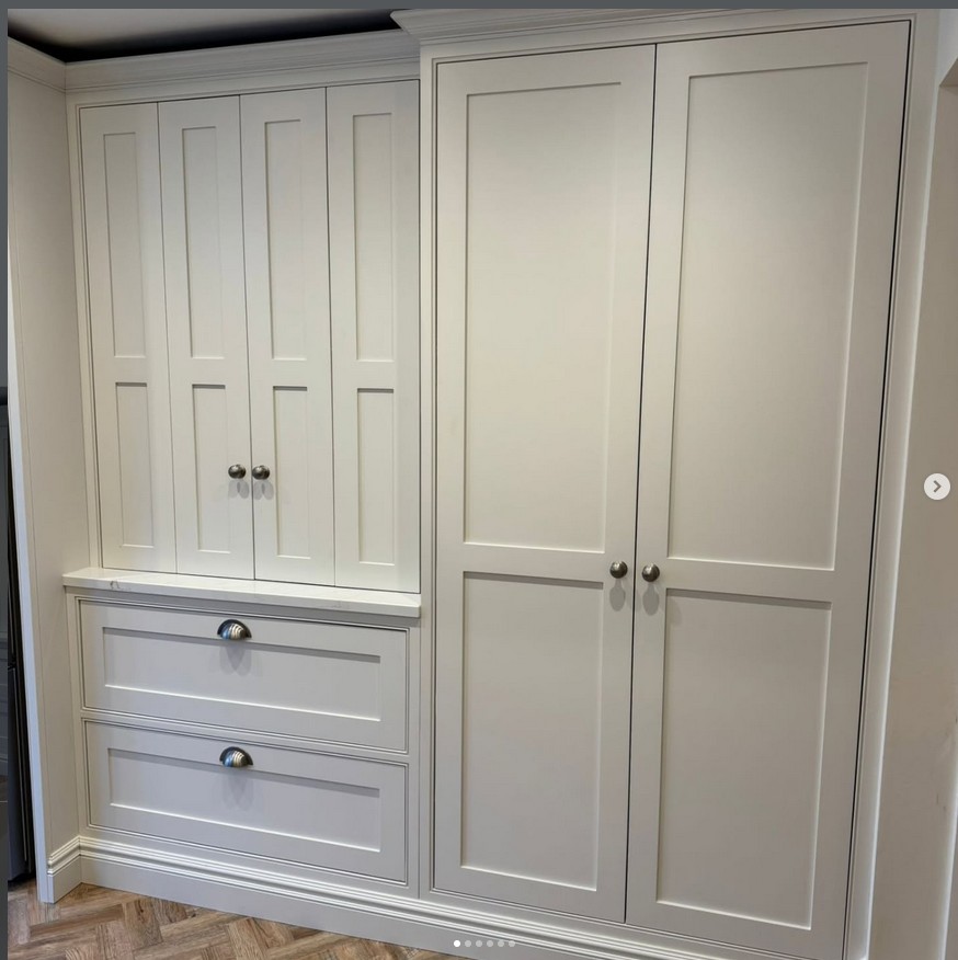 Bespoke fitted wardrobe with traditional paneling