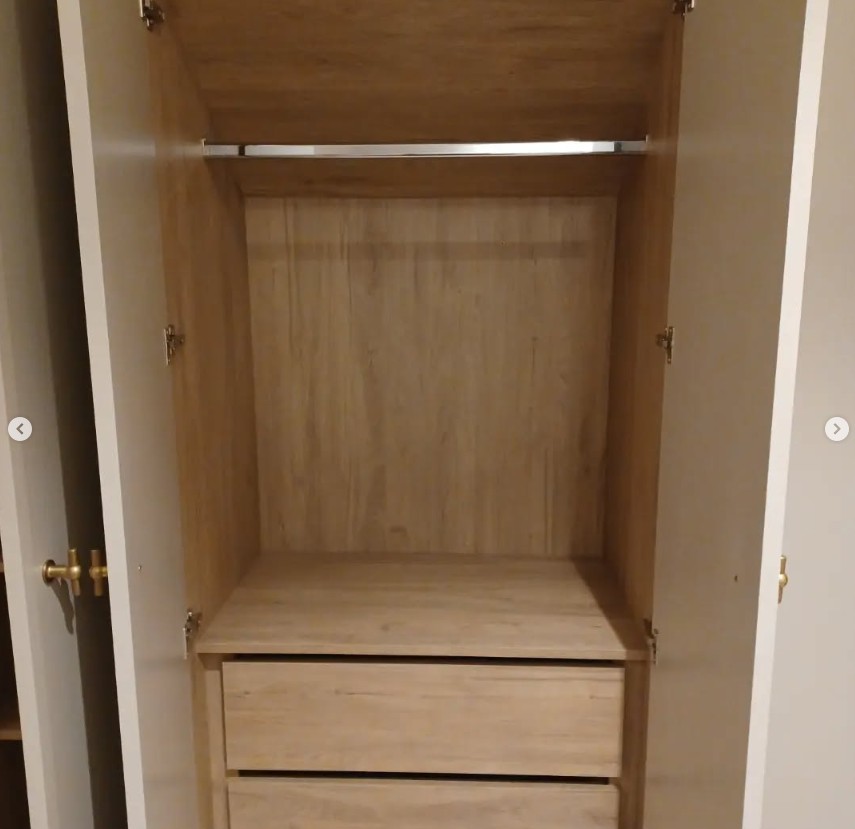 Bespoke wardrobe interior with hanging rail and drawer storage