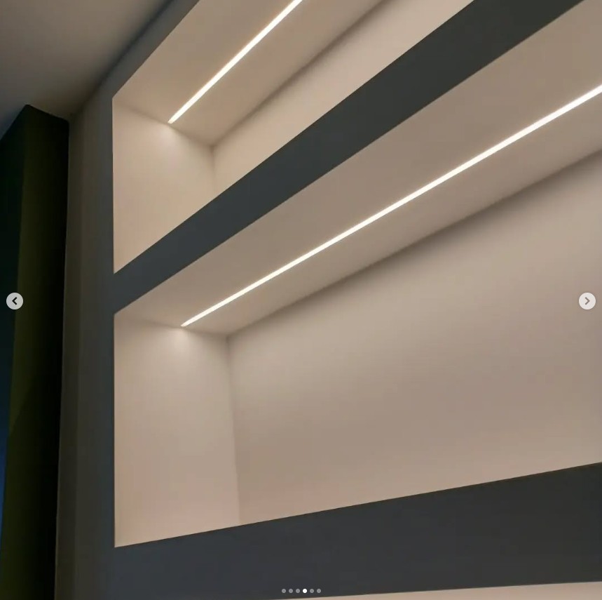 Detail of illuminated shelving with LED strip lighting