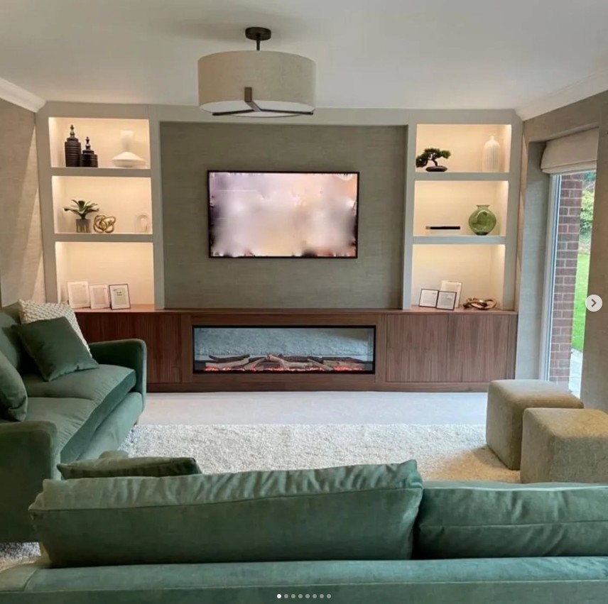 Media wall with walnut cabinetry and built-in fireplace