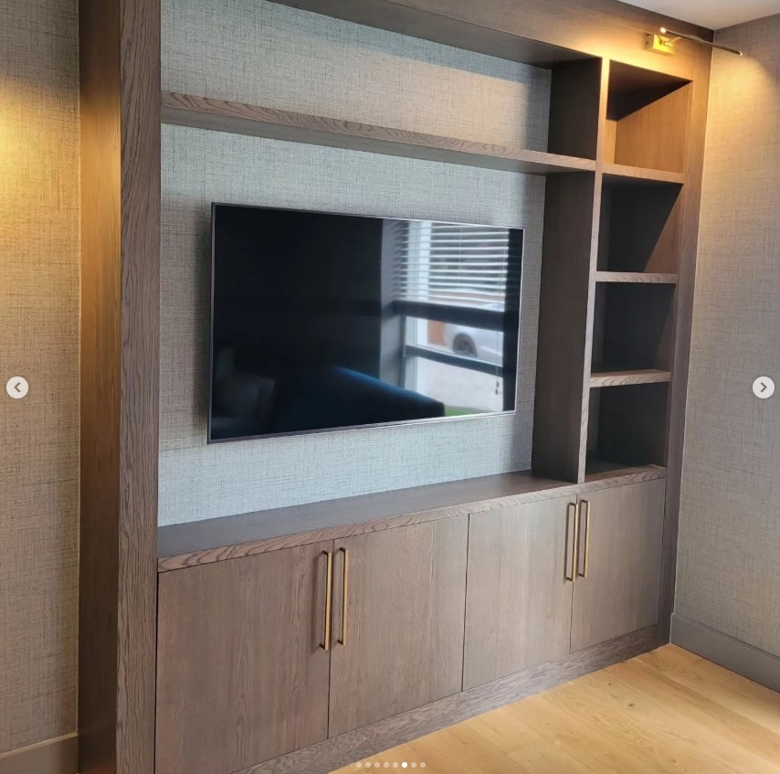 Media wall unit with textured fabric panels and open shelving