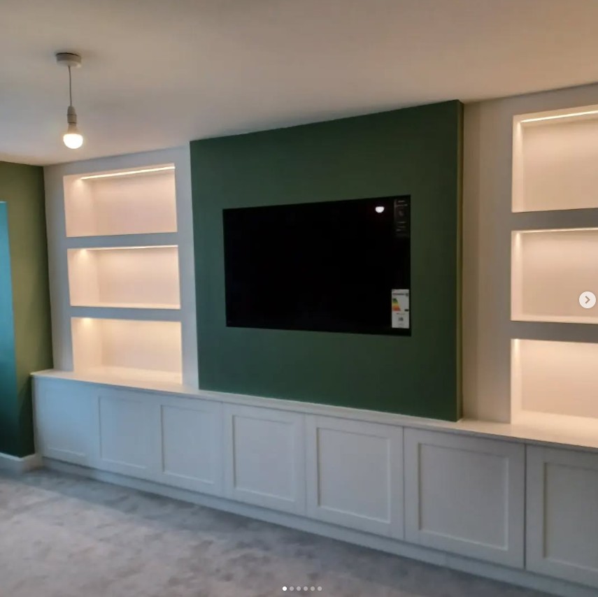 Media wall with green feature panel and integrated lighting