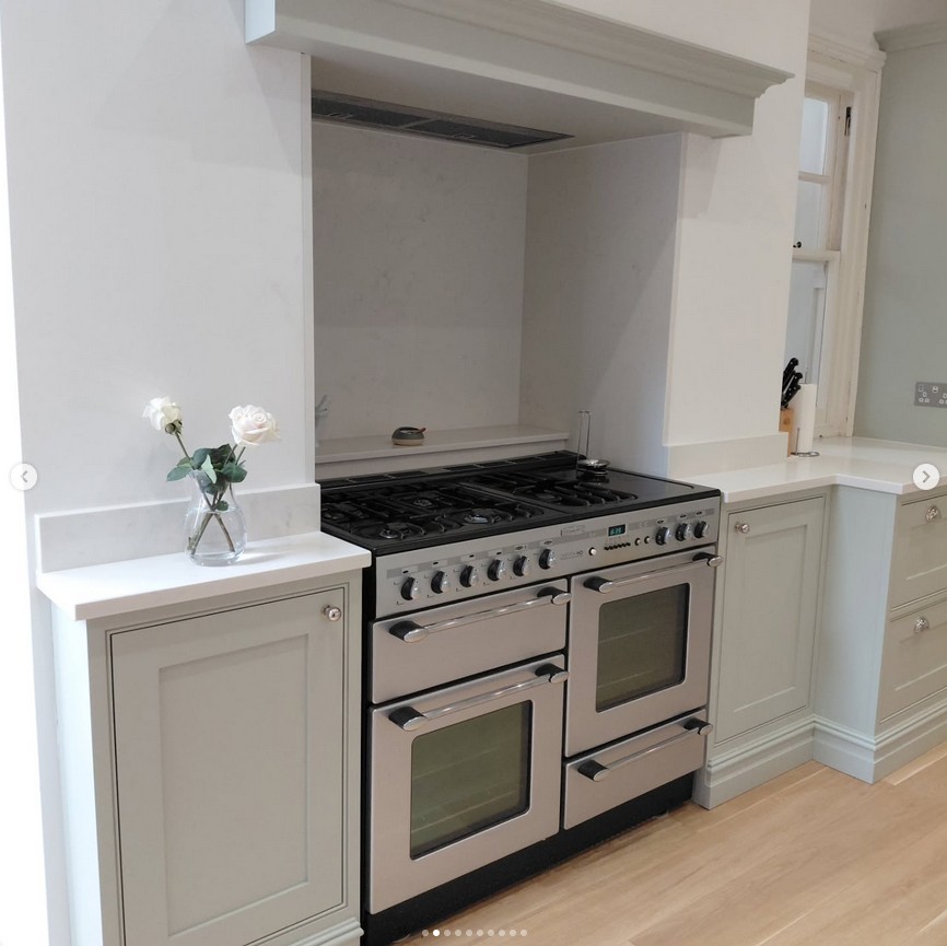 Traditional kitchen with range cooker and custom mantle