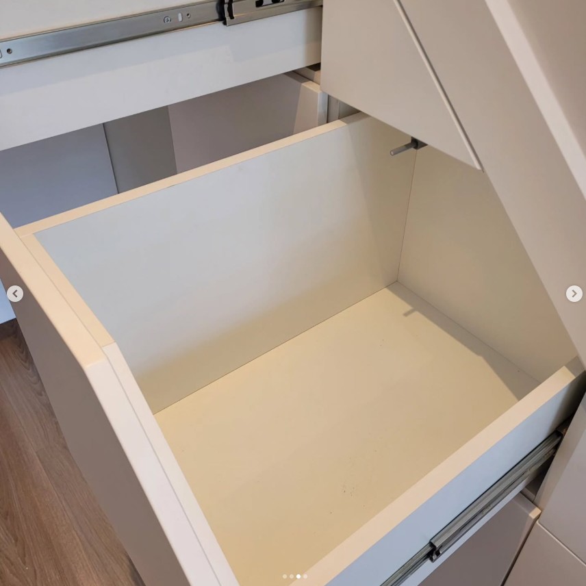 Detail of soft-close drawer mechanism in under stairs storage